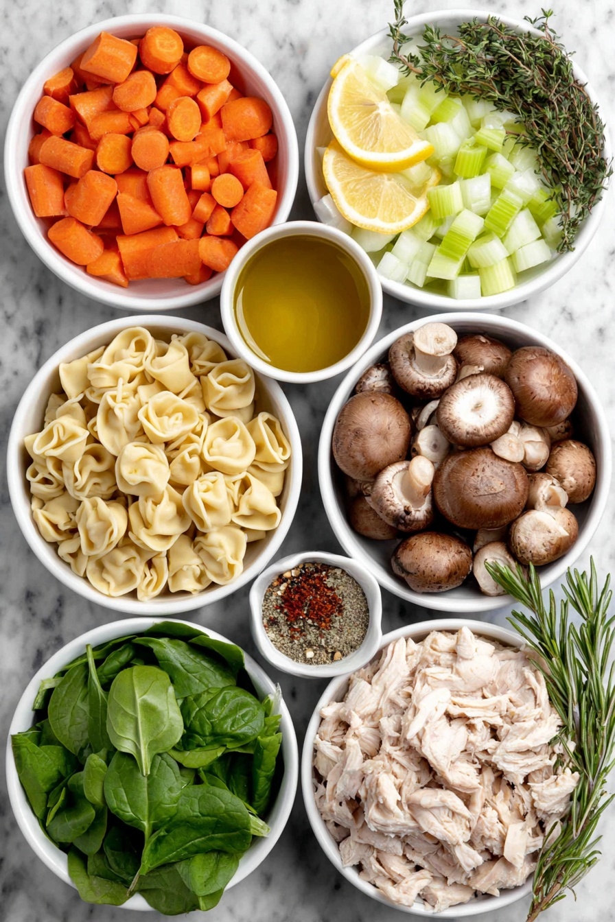 Flat lay of a small white ceramic bowl of golden olive oil, a medium chopped yellow onion, two diced orange carrots, two stalks of diced green celery, a small white ceramic bowl filled with sliced brown cremini mushrooms, four whole uncracked garlic cloves, a handful of snipped fresh green thyme leaves, a few sprigs of finely chopped fresh rosemary, a small white ceramic bowl with mixed Italian seasoning powder, a small white ceramic bowl containing red pepper flakes, a simple mound of fresh pale yellow cheese tortellini pasta, shredded cooked white chicken meat, a pile of fresh vibrant green baby spinach leaves, one halved bright yellow lemon, and a small white ceramic bowl with chopped fresh green parsley placed on a clean white marble surface, soft natural light, photo taken with an iPhone, professional food photography style, fresh ingredients, white ceramic bowls, no bottles, no duplicates, no utensils, no packaging --ar 2:3 --v 7 --p m7354615311229779997